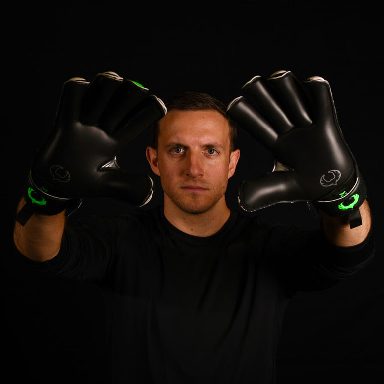male goalkeeper wearing vulcan abyss goalie gloves