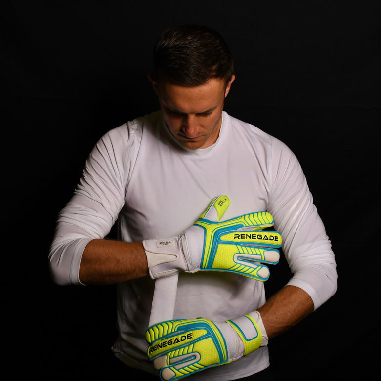 male goalkeeper wearing vulcan surge goalie gloves adjusting straps